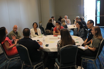 Event industry executives participate in a workshop known as 'World Café' during the BizBash Leadership Summit. Facilitated by Adrian Segar, founder of Conferences That Work, the workshop had the participants rotate between four tables, each labeled with a different topic of discussion. They tackled questions like: What's working and not working when it comes to audience engagement? How are you working with partners and vendors now that so much has changed since 2019?