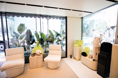 A seating area filled with lounges in BÉIS’s signature, neutral color palette and live greenery make the space feel like a luxe lobby. “A key element we drew inspiration from was the photoshoot for the Terry Collection at the Trixie Motel,” Petigrow explained. “We fused BÉIS beige with technicolor from the Trixie Motel to create The BÉIS Motel.”