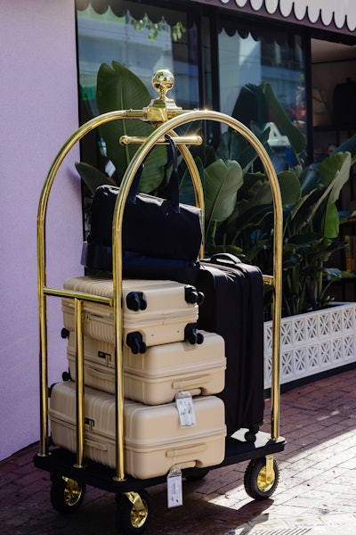 A bellhop cart staged outside The BÉIS Motel shows off some of the brand’s core luggage and weekender bags. “BÉIS products are really known for their functionality as well as how chic they are,” Petigrow said. To flaunt this, BÉIS employees will be on-site running demos, showing guests “the fun pockets hidden in the products and all of the key features of the bags.”