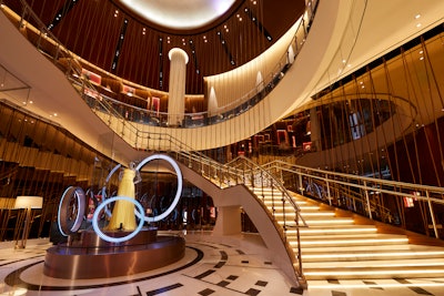 Guests are greeted with an impressive stone floor featuring a circular soundwave pattern and a grand marble stairway, which has the illusion of being held together by guitar strings.