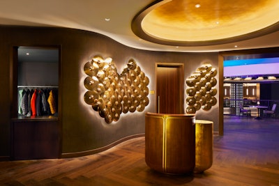 Brass cymbals adorn the walls of the foyer to The Venue on Music Row, an entertainment space spanning two floors of the Hard Rock Hotel New York that’s inspired by the jazz clubs, speakeasies, and dinner-theater performances of old New York.