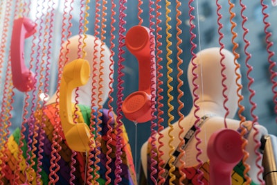 Anthony Santiago, the managing director at Pink Sparrow, explained that he and his agency “worked with UGG to ensure that everything we designed and built linked back to the theme of feeling heard.” Take this rainbow-colored telephone backdrop, for example, where dozens of phones hung from spiraled cords.