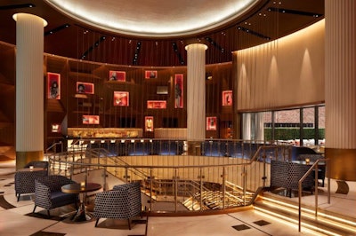 Located on the main level and accessible by a grand staircase from the street, the hotel brand’s signature Sessions Restaurant & Bar features a three-story atrium and open-air terrace. Hard Rock memorabilia is framed in custom millwork with bronze detailing.