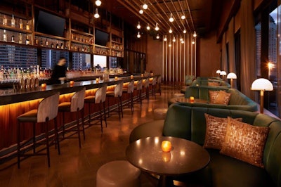 Located on the 34th floor, RT60 bar and lounge offers crafted cocktails and shareable bites, with views of the surrounding Midtown skyline. The interior space is layered with lush green- and blue-toned fabrics and warm brass detailing to mimic guitar strings.