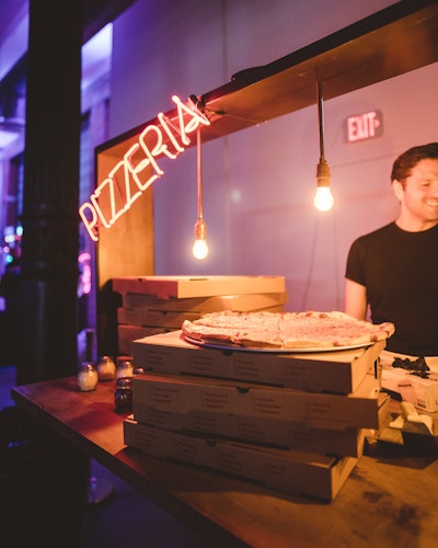 “For food, we provided quintessentially urban New York-style pizzas, making this a block party that both looked and tasted great,” MacIntyre said. All custom builds at Gutter City, including the pizzeria, were provided courtesy of local fabrication and rental company propNspoon.