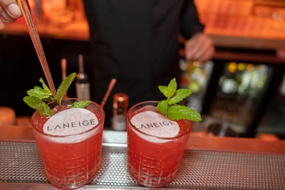 Naturally, the bar served up pink-hued cocktails, including the Miami Mule—with vodka, muddled raspberries, lime juice, mint, and ginger beer—and the Berry Spritz—a mix of prosecco, black raspberry liqueur, berries, and soda water. In a fun, branded touch, an edible piece of paper laid atop each beverage boasted Laneige’s logo.