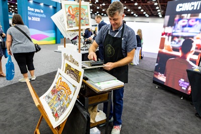 At Visit Cincy's booth, attendees could see screen-printing in action. James Billiter of Billiter Studios printed limited-edition Cincinnati prints for attendees who stopped by.