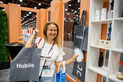 The Hubilo booth proved to be the perfect oasis on the trade show floor, with its windowed enclosure, pastel orange walls, and greenery. (The champagne bar didn't hurt either.) Happy attendees could leave with Hubilo-branded bags, tumblers, and espadrilles.
