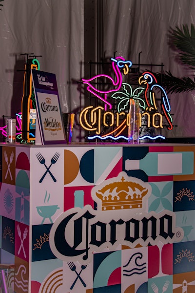 GrillHampton was presented by Corona, which boasted a playful booth characterized by its tropical neon lighting and playfully patterned bar. Beer and specialty cocktails were accompanied by grilled fare, live music, and dancing.
