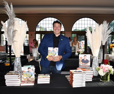Chef Rocco DiSpirito—known for starring in the TV program The Restaurant—was on-site signing copies of his cookbooks for VIP guests.
