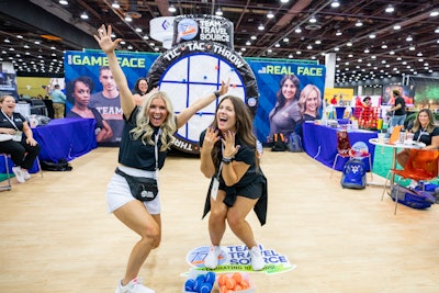 Game on! Enticing attendees to your booth is easier with a giant inflatable game. This year, attendees could hang with Team Travel Source and try out, among other games, the tic-tac-'throw' for prizes.