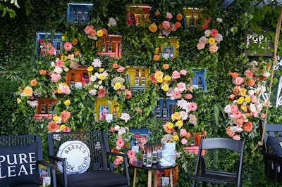 Fresh greenery and summer-inspired florals created vibrant backdrops for both pop-up events held in Los Angeles and Boston last month.