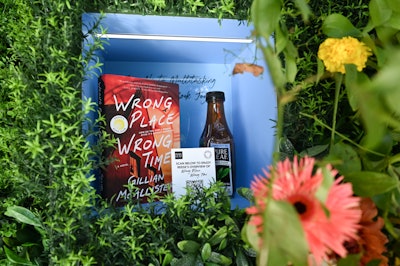 Nestled within the floral-clad installation, built-in shelves were filled with arrangements of a Pure Leaf bottle paired with a 'Summer Pick' from Reese’s Book Club. Each vendetta was topped off with a coordinating QR code that allowed guests to learn more about the novels.
