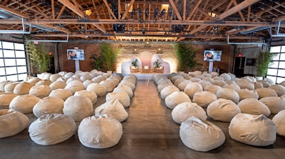 Speaking of bean bags, the comfortable seating option has become a popular choice for conferences and education sessions of all types. A recent example? Gymshark's 2021 activation in Los Angeles, which used bean bag chairs as seating. Getting the exact right level of comfort was important, said the event's producer, Matt Stoelt of Stoelt Productions: The chairs had to be soft enough to be comfortable, but he also didn’t want attendees zoning out during the panels. See more: 7 Things Event Marketers Can Learn From This Gymshark Brand Activation