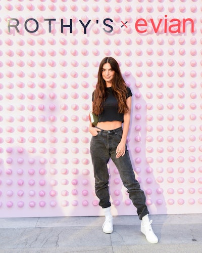 The guest list was star-studded and welcomed Swiss tennis player Stan Wawrinka, model Johannes Huebl, and Emma Ratajkowski, who’s pictured posing in front of a branded, tennis-ball-covered step and repeat.
