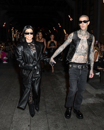 Kardashian Barker attended the runway show with husband Travis Barker.