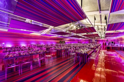 For the Museum of Contemporary Art’s 2015 benefit in Chicago, HMR Designs used multicolored, striped fabrics in shades of red, burnt orange, royal blue, golden yellow, and chartreuse green. 'A concept I've wanted to do for a long time, this design was modernism at its most elemental,' said HMR Designs’ Bill Heffernan at the time. 'The approach was, in essence: Don't decorate the room–create the room. The bright, multicolored stripes were chosen for their boldness and to create an optical illusion, so as to challenge the senses of the guests.'