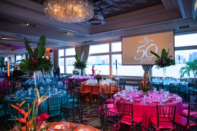 The gala dinner theme was 'Havana Nights,' and tables inside the ballroom were dressed in hot pink, turquoise, and orange. To further nod to the theme, centerpieces featured birds of paradise, palms, and monstera leaves.