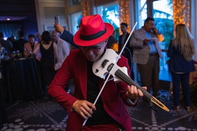 An electric violinist strummed popular hits during the cocktail hour.