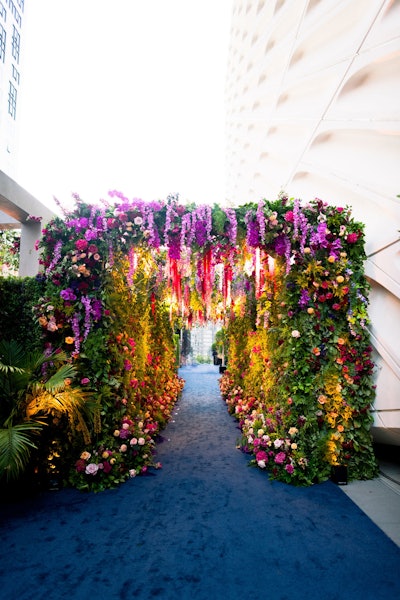 Sterling Engagements worked with Shawna Yamamoto Event Design on floral design and decor. A standout installation included this dreamy, museum-inspired floral tunnel. 'Modern botanic brilliance began by the simple idea to integrate jewel tones, botanical greens, and luxe blooms,' said Alexandra Rembac, the founder and creative director at Sterling Engagements. 'Then we added layers of European whimsy and alluring details.'