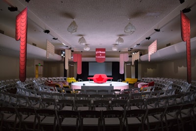 An idea that's a little more down to earth—but that still offers a striking visual impact—is to arrange chairs to create a theater-in-the-round setup. It's an idea the third Girlboss Rally, which took place in 2018 in Los Angeles, used in order to get guests closer to the speakers. In the front row were couches and lounge chairs. 'It [was] really inviting; people wanted to hang out there for hours,' said event designer Nicky Balestrieri of The Gathery. See more: How Girlboss Created a 'Conference Unlike Any Other Conference'