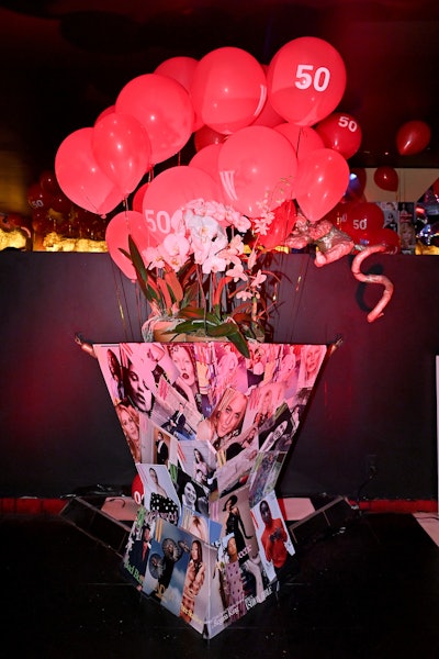 The magazine collage idea continued into the event, which also featured red birthday balloons and a dance floor ceiling covered in '70s-inspired disco balls.
