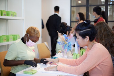 Other stations included a press-on nail station from PaintLab (pictured), along with eyes, brows, and glitter touch-ups with Too'D; candle pouring with Wax Buffalo; mini facials with Skin Gym; and intention setting with Smudge Wellness.