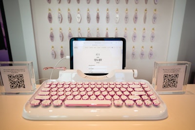 On a BÉIS-branded check-in desk was a pink, retro keyboard, where guests answered questions to sign up for targeted marketing emails. Any attendee that made a purchase on-site received a 15% discount, a reusable bag, and a pink motel keychain boasting the company’s logo. See more: Vacay State of Mind: Shay Mitchell's BÉIS Hosts Motel Pop-Up in LA