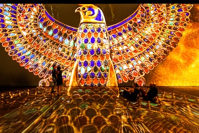 The exhibition uses a mix of images from National Geographic’s archives, replicas of artifacts, and projections that are over two stories tall.