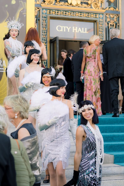 Entertainers in 1920s flapper dresses lined the entry, offering a memorable photo moment when attendees arrived at City Hall.