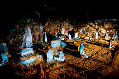 Beyond the ranch lies Hidden Hollows, “where guests will find themselves immersed in our graveyard set with 15-foot skeletons ushering them in,” Smith explained. Here, beware of 20-foot skeleton hands emerging from the ground.