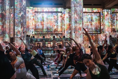 During sun salutations and flows, guests are surrounded by glowing, animated, 30-foot-high custom displays of art images—all synchronized to an original soundtrack.