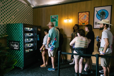 Attendees could play with the Hulu vending machine, which popped out short poster tubes full of goodies like koozies, fans, sunglasses, and portable phone chargers in snack-bar packaging.