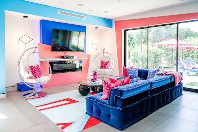 The entire house was painted in the new product's brand colors, along with '90s-inspired artwork that also featured the brand. Due to the length of the activation, most of the furniture was purchased and rehomed via a garage sale at the end of the month. One key challenge was making sure the house didn’t trend too childish, especially considering the alcoholic product it was promoting. “Not only was the product color palette a little youthful, but the nostalgia specific to the age group that it targets—30s and 40s—was mostly childhood nostalgia,” pointed out Hoff. “We walked a fine line to make sure that we had fun, vibrant graphics that weren’t juvenile, and we were intentional to not include many toys in our throwbacks.”