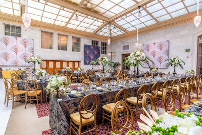 For the arrival reception and dinner, attendees were immersed in an environment retrofitted with a palette of indigo, goldenrod, and onyx, explained the Blueprint Studios team. A mix of periodic textiles—such as velvet, leather, crystal, mirror, and ostrich plumes—was mixed throughout each space.