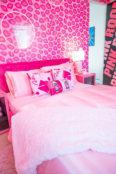 A Clueless-inspired pink room featured a Polaroid camera and wall where guests could display their photos. There was also a red room centered around '90s grunge and Nirvana. The space included a camcorder for guests to record confessional-style videos on VHS tapes, as well as an interactive background where they could rearrange fun sayings from the decade.