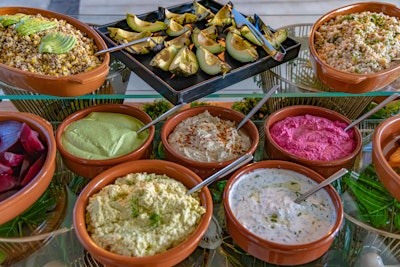 The “herbivore” grazing station featured an assortment of grilled veggies like eggplant and zucchini served with colorful dips including edamame hummus, baba ganoush, and cucumber tzatziki.