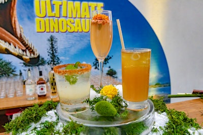 The event’s specialty cocktails included “Spinosaurus Spice-arita” with tequila, jalapeno, lime, cilantro, and a sweet-and-spicy rim; “The Fossil Hunter” with prosecco, elderflower, and grapefruit; and “Jurassic Julep” with bourbon, sweet tea, lemon, lime, and mint.