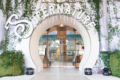 A stunning white “Supernature” archway dripping in foliage welcomed all through the hotel’s front doors.