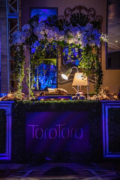 The InterContinental Miami's on-site Latin steakhouse Toro Toro presented a meat-carving station at the cocktail reception accented by foliage and fresh florals.