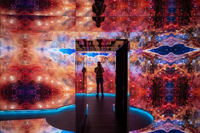 Visitors could walk through a “galaxy room” with mirrored walls, floors, and a ceiling that projected images from the James Webb Space Telescope.