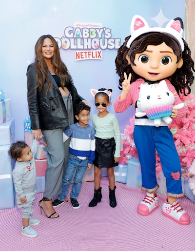 The event was invite-only, with a total of 210 guests in attendance, including Chrissy Teigen and her two children, Luna (right) and Miles (center).