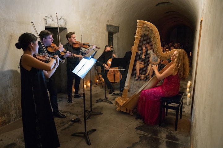 Harpist Bridget Kibbey performed in the catacombs accompanied by a team of string players.