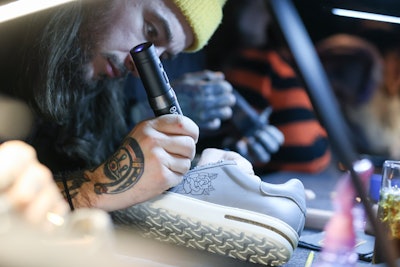 Guests could order a pair of Birkenstock Bend sneakers with customization by Three Kings Tattoo studio and laser engraving provided by Birkenstock’s in-house team.