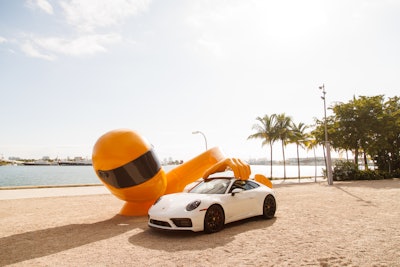 During The Gateway, Porsche announced its 2023, 7,500-piece NFT collection based on the classic Porsche 911, and continued to position visibility throughout the week. Porsche also presented The Art of Dreams, an international initiative supporting art based on the idea of dreams, at the Pérez Art Museum Miami (PAMM). For the PAMM piece, Chris Labrooy transformed the Porsche into a toy car for a childlike sculpture. An equally whimsical Chris Labrooy Porsche piece landed on the sands outside of SoHo Beach House.