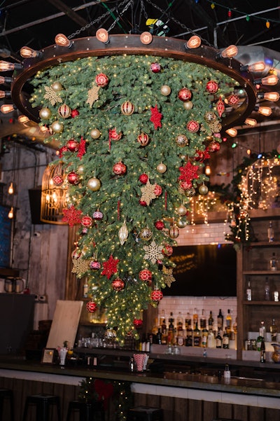 Other decor includes an upside-down Christmas tree chandelier.