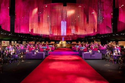 The Television Academy’s Governors Ball in September 2019 featured a vivid ceiling installation made from 310,000 strands of silk thread and almost 77,000 individual crystals. Sequoia Productions handled design and production for the event, which boasted a color palette that included shades of eggplant, magenta, blush, and coral with touches of gold. See more: Emmys 2019: Design and Production Highlights From the Week's Most Glamorous Parties
