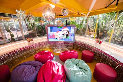 In Pillow Cat's Corner screening room—a space inspired by the show's plush character—little ones were invited to watch a holiday episode of Gabby's Dollhouse on colorful bean bags.