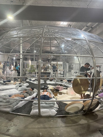 The Wellness Dome at Wonderland Miami invited attendees into a comfortable meditative sphere where they could sit back and relax on individual beds accompanied by sound baths and various wellness talks.