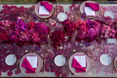 JOWY Productions brought to life a Barbie-inspired dream with this glamorous afternoon luncheon at a private residence in Malibu. Gilded chairs with bright magenta cushions surrounded a table covered in florals by Celio's Design.